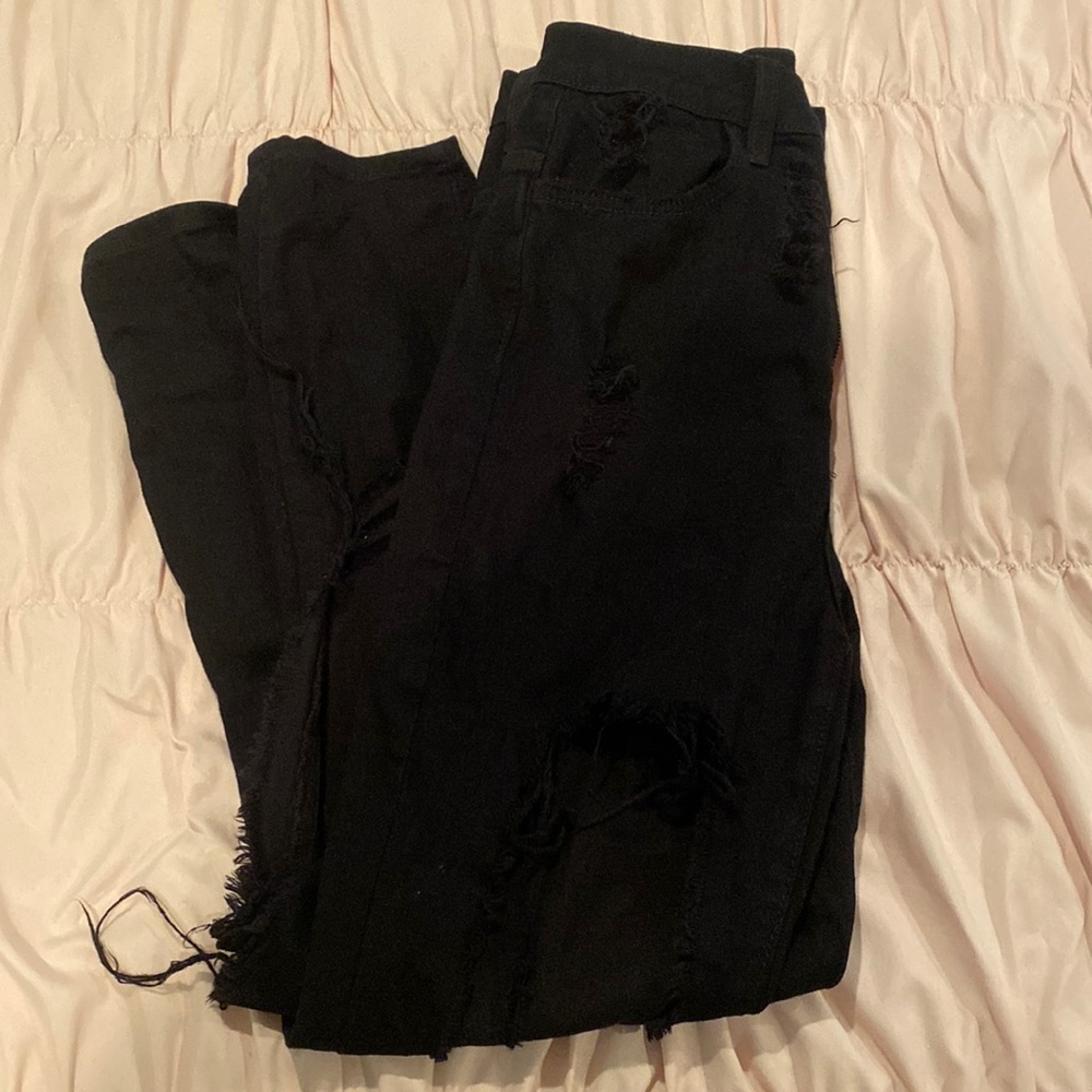 Ultra distressed Black Denim